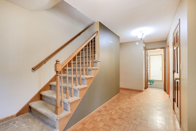 stairs featuring baseboards