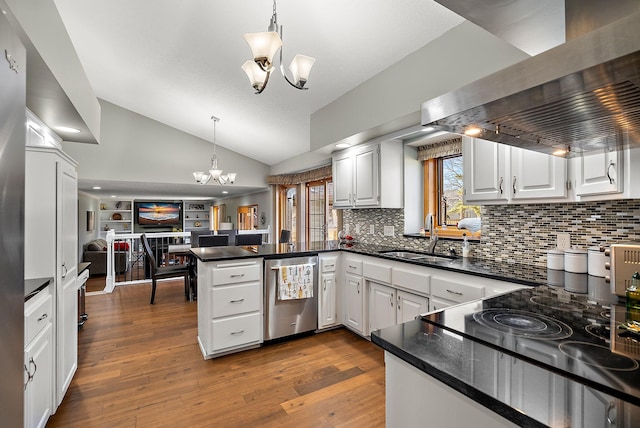 3220 Highlands Rd, Brooklyn Park, MN 55443 - kitchen with a chandelier, a peninsula, extractor fan, open floor plan, and lofted ceiling