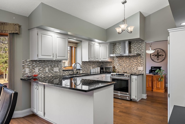 3220 Highlands Rd, Brooklyn Park, MN 55443 - kitchen with a peninsula, stainless steel range oven, dark countertops, vaulted ceiling, and wall chimney range hood