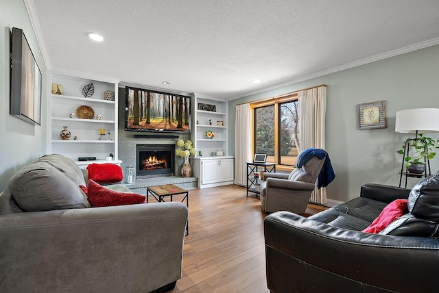 3220 Highlands Rd, Brooklyn Park, MN 55443 - living room featuring a brick fireplace, a textured ceiling, wood finished floors, ornamental molding, and recessed lighting