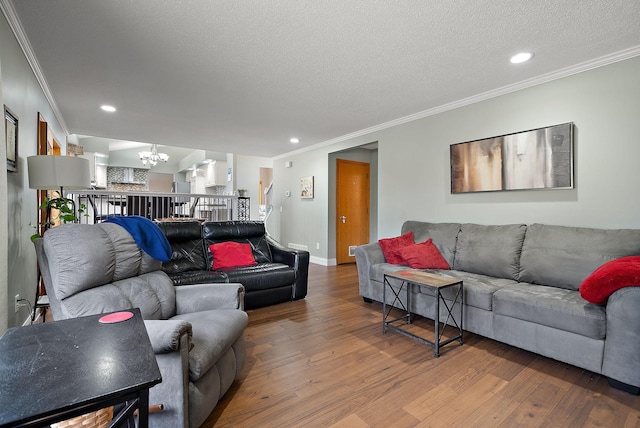 3220 Highlands Rd, Brooklyn Park, MN 55443 - living area featuring a chandelier, wood finished floors, crown molding, a textured ceiling, and recessed lighting