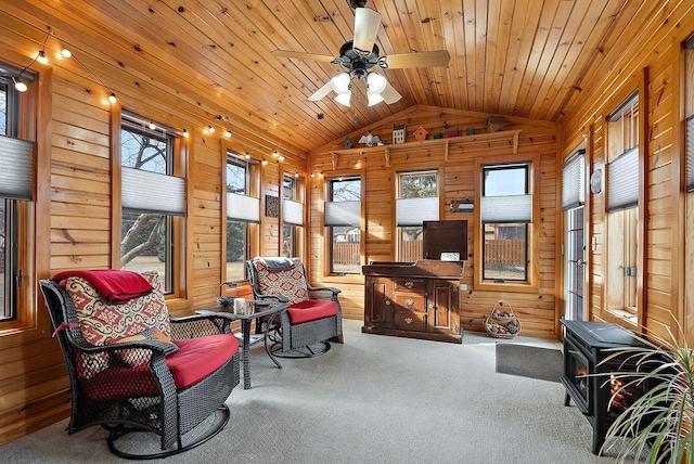 3220 Highlands Rd, Brooklyn Park, MN 55443 - sitting room with wood walls, vaulted ceiling, carpet flooring, ceiling fan, and wood ceiling