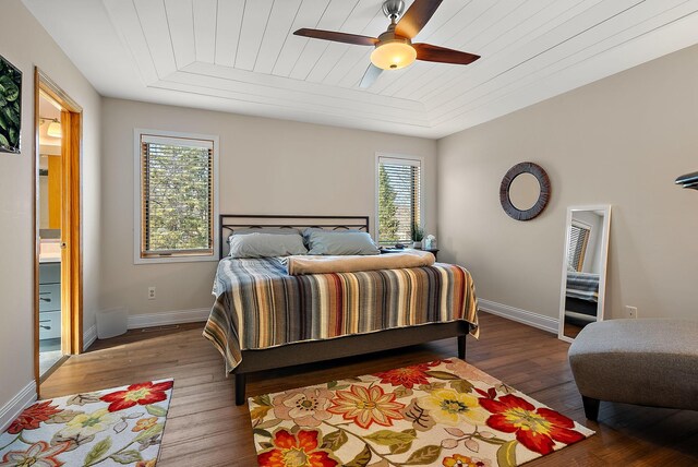 3220 Highlands Rd, Brooklyn Park, MN 55443 - bedroom with multiple windows, wood finished floors, wooden ceiling, ceiling fan, and connected bathroom