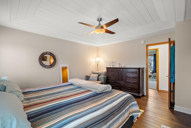 3220 Highlands Rd, Brooklyn Park, MN 55443 - bedroom with dark wood-type flooring, wooden ceiling, and ceiling fan