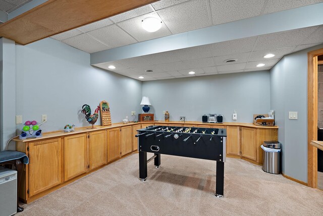 3220 Highlands Rd, Brooklyn Park, MN 55443 - rec room featuring a drop ceiling, light carpet, and recessed lighting
