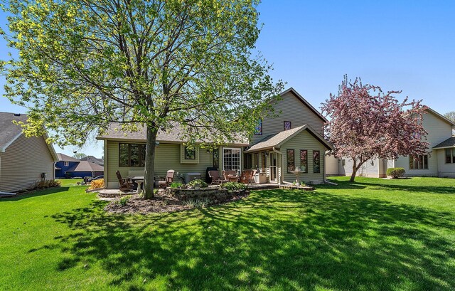 3220 Highlands Rd, Brooklyn Park, MN 55443 - back of property featuring a yard and a patio area