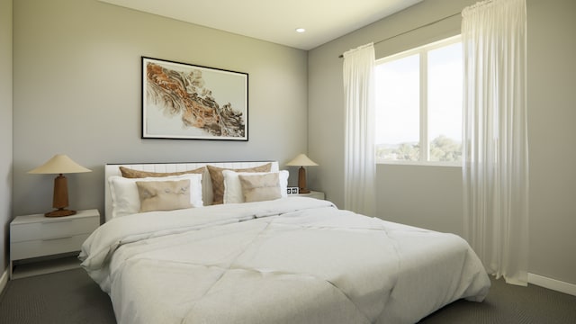 bedroom with carpet flooring and baseboards