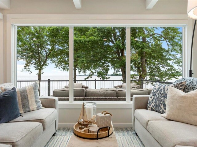living room with wood finished floors and ceiling fan