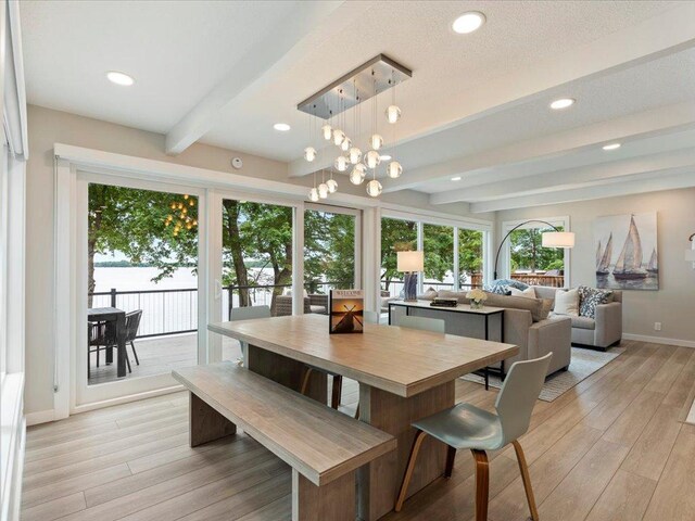dining room with beamed ceiling, recessed lighting, light wood-style floors, and baseboards