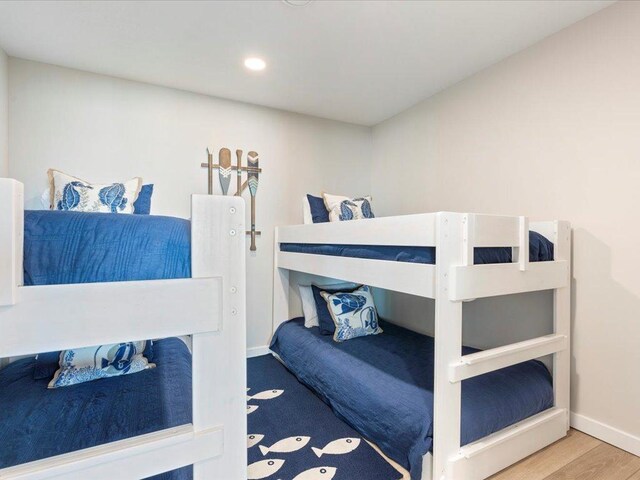 bedroom featuring recessed lighting, wood finished floors, and baseboards