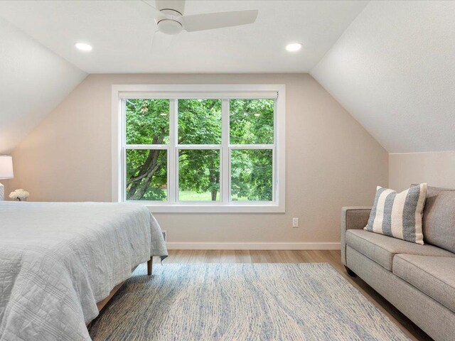 bedroom featuring baseboards, vaulted ceiling, recessed lighting, wood finished floors, and a ceiling fan