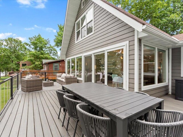wooden deck featuring outdoor dining space and outdoor lounge area