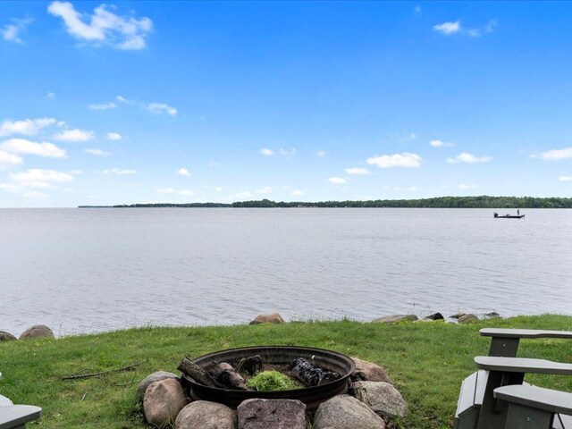 property view of water featuring an outdoor fire pit