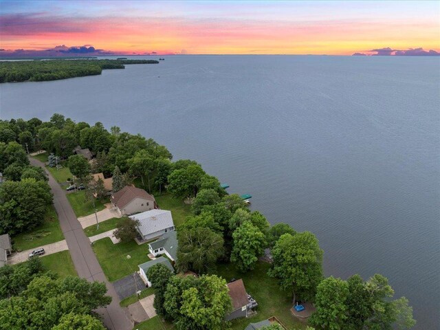 aerial view at dusk with a water view