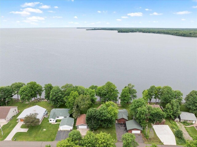 birds eye view of property featuring a water view and a residential view