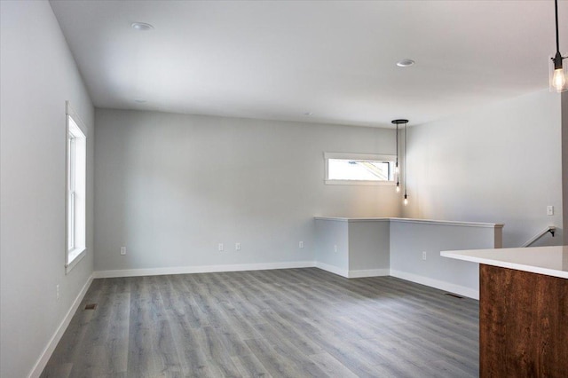 interior space with recessed lighting, baseboards, and dark wood-style flooring