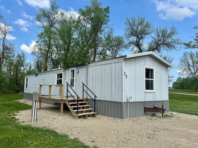 28714 County Road 112, Dieter Twp, MN 56751 - rear view of property with a wooden deck and a yard