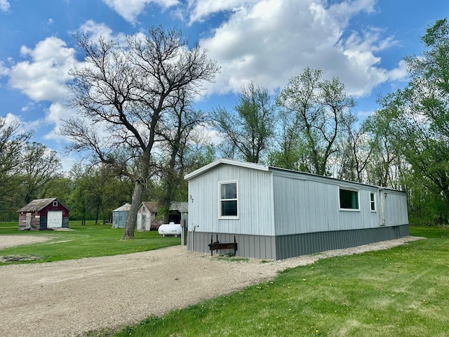 28714 County Road 112, Dieter Twp, MN 56751 - view of home's exterior with a yard and dirt driveway