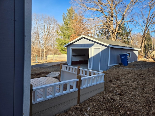 view of shed featuring fence