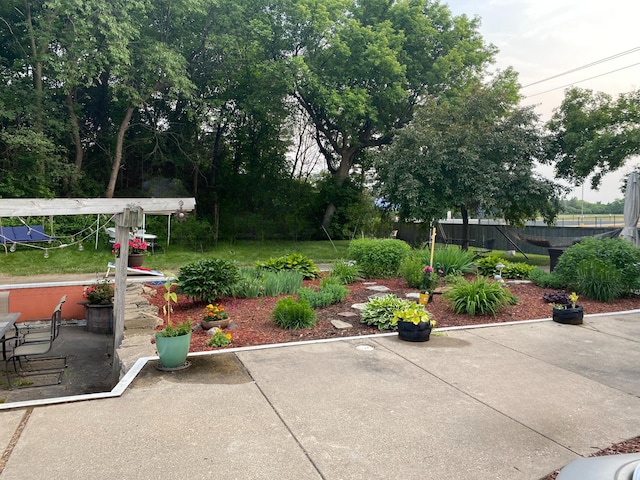 exterior space featuring a patio area, a pergola, and fence