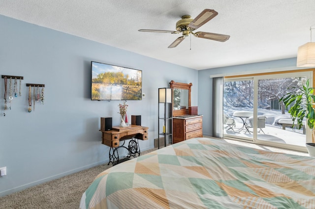 carpeted bedroom featuring baseboards, a textured ceiling, a ceiling fan, and access to outside