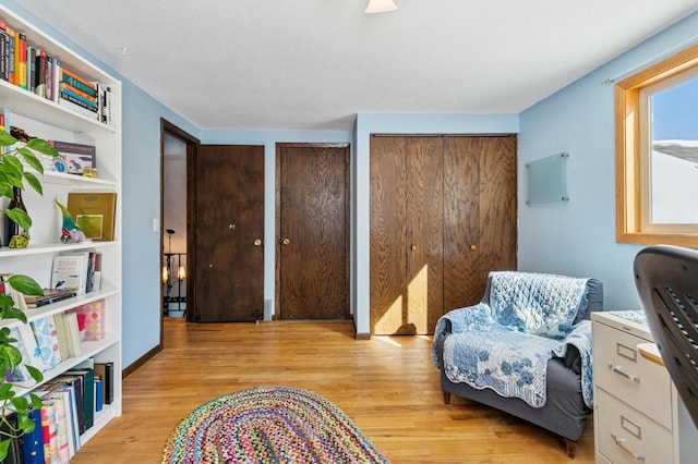 living area with light wood-style floors