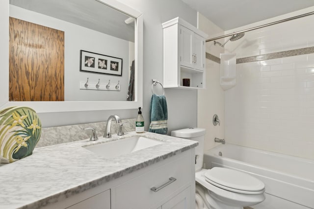 full bath featuring toilet, bathtub / shower combination, and vanity