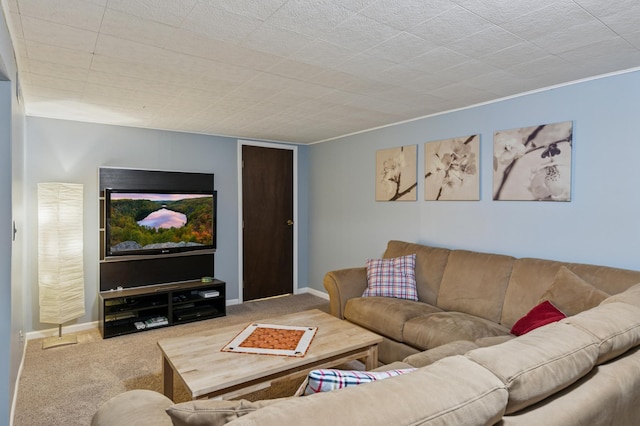 living room featuring carpet flooring and baseboards