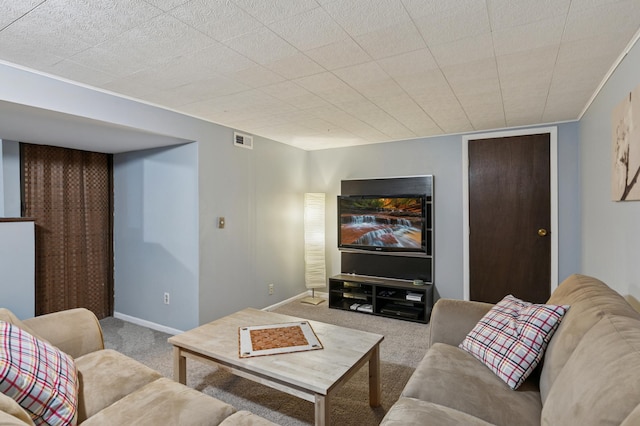 living area featuring carpet, visible vents, and baseboards