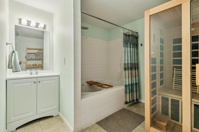 bathroom with vanity, a sauna, baseboards, and tiled shower / bath combo