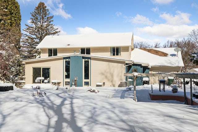 view of snow covered house