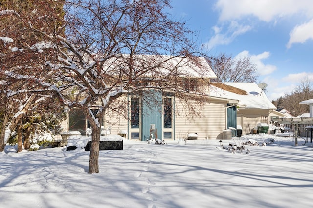 view of snow covered house