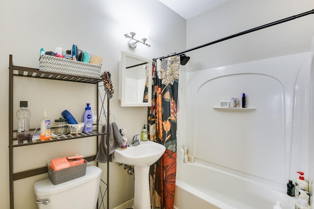 bathroom featuring shower / bathtub combination with curtain and toilet