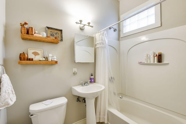 full bathroom with shower / tub combo and toilet