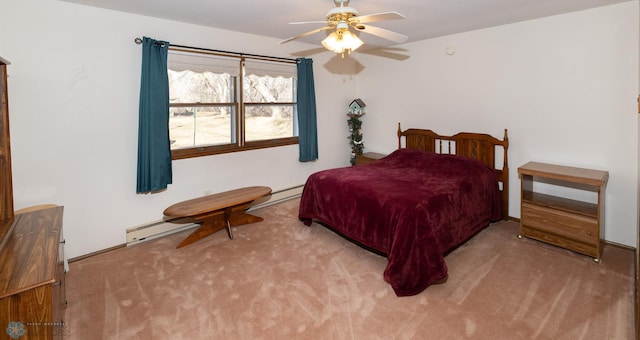 carpeted bedroom featuring baseboard heating and ceiling fan