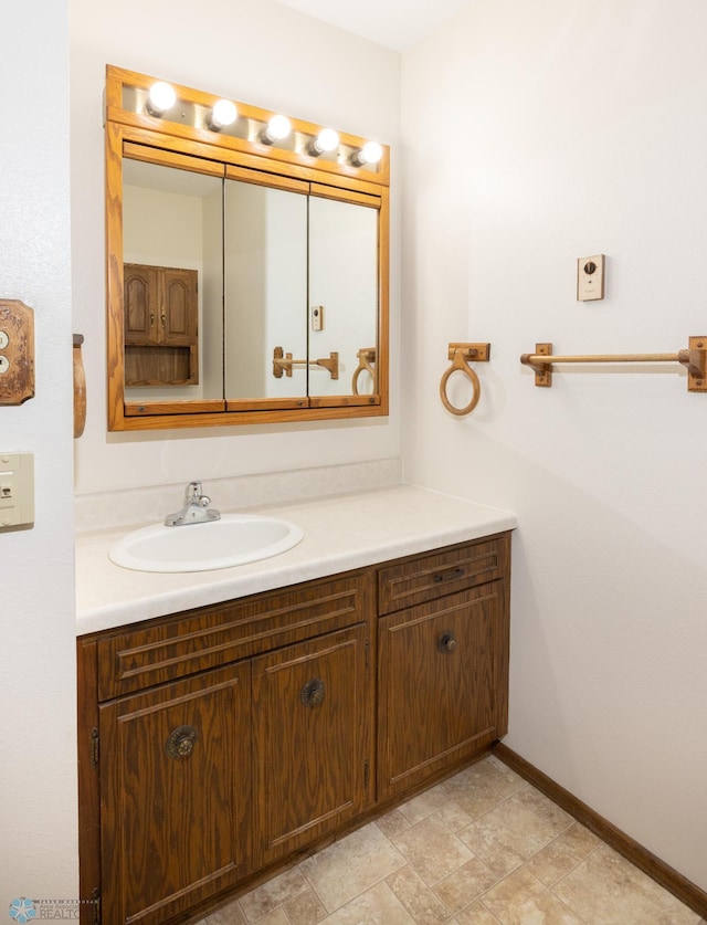 bathroom with vanity and baseboards