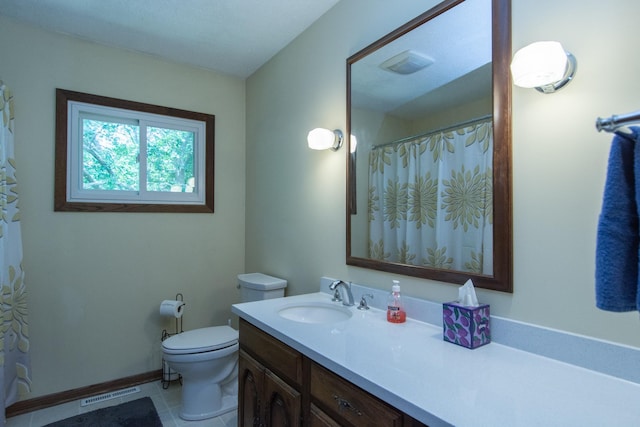 bathroom featuring tile patterned flooring, visible vents, vanity, and toilet