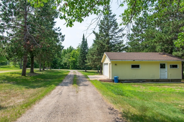 view of street with dirt driveway