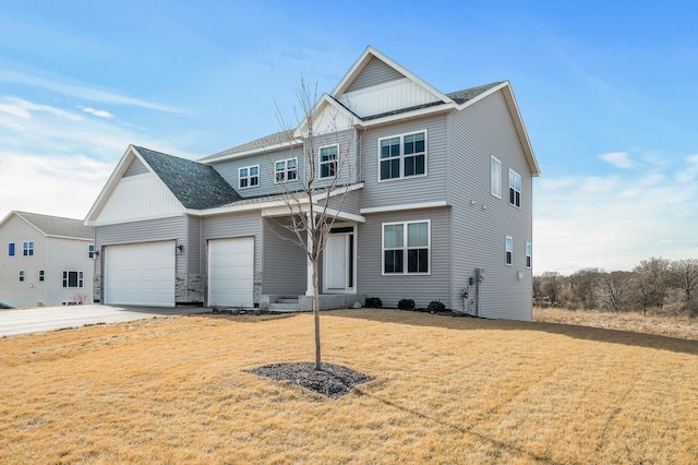 view of front facade with a garage, concrete driveway, roof with shingles, board and batten siding, and a front yard