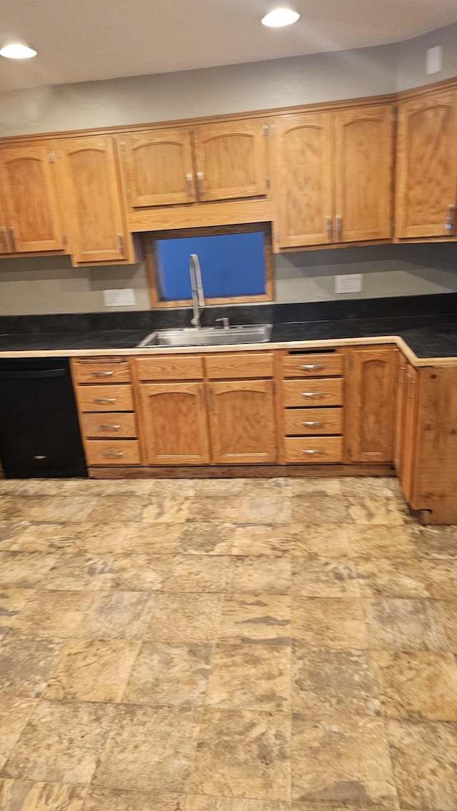 kitchen featuring black dishwasher, brown cabinetry, a sink, and recessed lighting