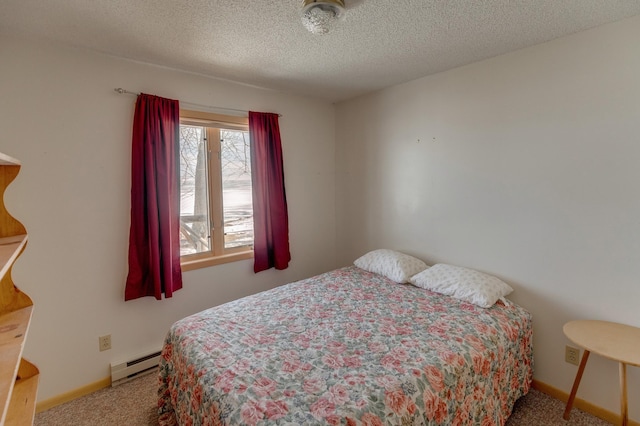 carpeted bedroom featuring a textured ceiling, baseboard heating, and baseboards