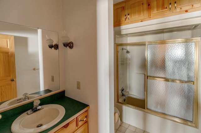 full bathroom featuring combined bath / shower with glass door and vanity