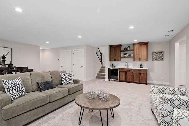 living room with indoor wet bar, recessed lighting, stairway, light carpet, and beverage cooler