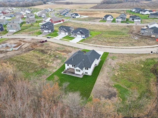 birds eye view of property with a residential view