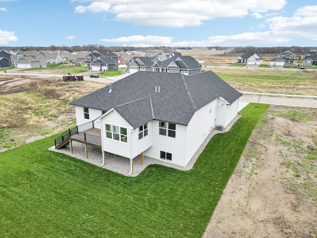 birds eye view of property with a residential view