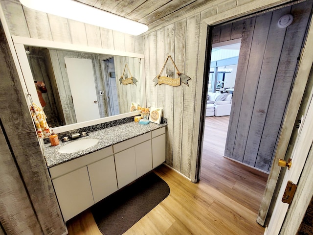 bathroom featuring vanity and wood finished floors