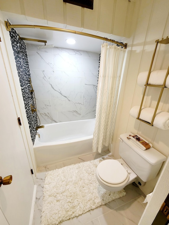 bathroom featuring toilet, shower / bathtub combination with curtain, and marble finish floor