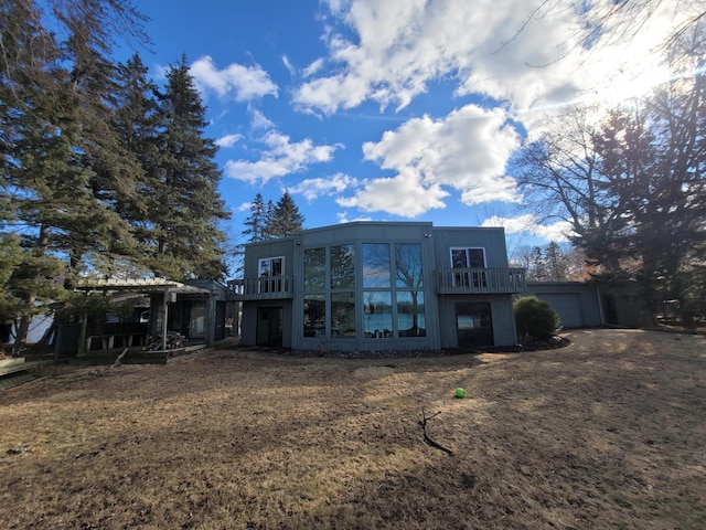 back of property with a garage