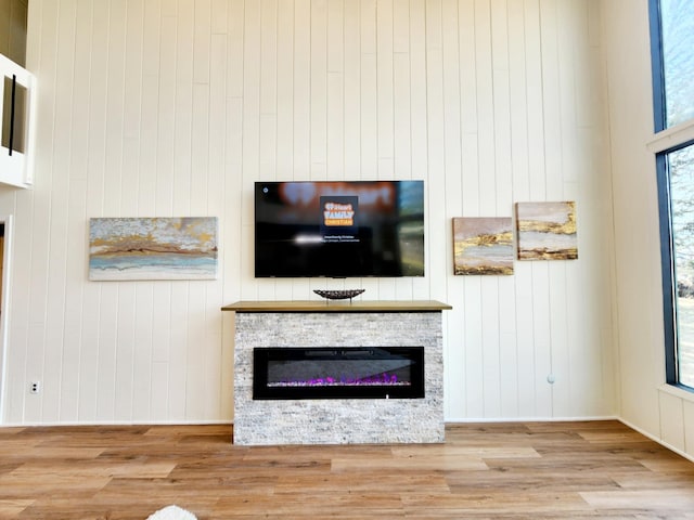 unfurnished living room with wood finished floors and a fireplace