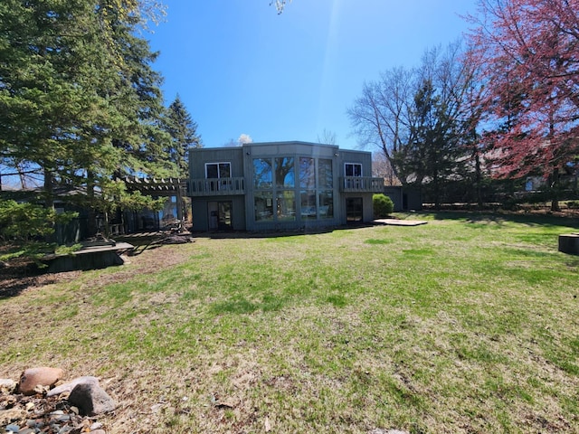 view of yard featuring a balcony